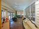 Sunroom with wooden floors and access to backyard at 2395 Windward Cv, Kissimmee, FL 34746