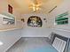 Small workshop with shelving and unique wall art at 2395 Windward Cv, Kissimmee, FL 34746