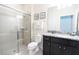 Clean bathroom with granite vanity and a walk-in shower at 2472 Dubai St, Kissimmee, FL 34747