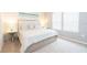 Main bedroom with a king-size bed and light decor at 2472 Dubai St, Kissimmee, FL 34747