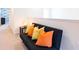 Hallway featuring a black futon with colorful pillows at 2472 Dubai St, Kissimmee, FL 34747