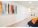 Bright hallway with surfboard art and a comfortable futon at 2472 Dubai St, Kissimmee, FL 34747