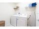 Laundry room with washer, dryer, and shelving at 2472 Dubai St, Kissimmee, FL 34747