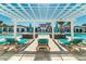 Community pool with lounge chairs under a pergola, offering resort-style living at 2472 Dubai St, Kissimmee, FL 34747