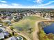 Wide shot of community featuring a large green space and lake at 2583 Grassmoor Loop, Apopka, FL 32712