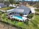 Home's backyard features a refreshing pool and pergola at 2583 Grassmoor Loop, Apopka, FL 32712