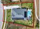 House with solar panels and a pool, highlighted by a red outline at 2583 Grassmoor Loop, Apopka, FL 32712