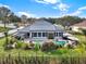 Aerial view of home showcasing pool, solar panels, and backyard oasis at 2583 Grassmoor Loop, Apopka, FL 32712