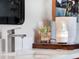 Modern bathroom vanity with sleek faucet and white countertop at 2583 Grassmoor Loop, Apopka, FL 32712