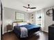 Bright bedroom featuring a king-size bed and modern decor at 2583 Grassmoor Loop, Apopka, FL 32712