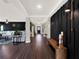 Bright and spacious entry hall with dark hardwood floors and modern decor at 2583 Grassmoor Loop, Apopka, FL 32712