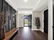 Bright entryway with dark wood bench and walls at 2583 Grassmoor Loop, Apopka, FL 32712