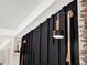 Gold and black wall sconces with wooden beads at 2583 Grassmoor Loop, Apopka, FL 32712