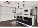 Modern kitchen with white cabinets and a large island at 2583 Grassmoor Loop, Apopka, FL 32712