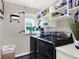 Laundry room with washer, dryer, and storage shelves at 2583 Grassmoor Loop, Apopka, FL 32712