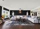 Large living room with sectional sofa and dark walls at 2583 Grassmoor Loop, Apopka, FL 32712