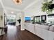 Spacious living room with hardwood floors and sectional sofa at 2583 Grassmoor Loop, Apopka, FL 32712