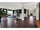 Bright and airy living area with hardwood floors and a stylish color scheme at 2583 Grassmoor Loop, Apopka, FL 32712
