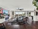 Living room with a cozy sectional sofa and a fireplace at 2583 Grassmoor Loop, Apopka, FL 32712