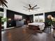Large main bedroom with dark walls, a ceiling fan, and plenty of natural light at 2583 Grassmoor Loop, Apopka, FL 32712