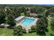 Aerial view of community pool with surrounding landscaping at 2583 Grassmoor Loop, Apopka, FL 32712