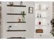 Stylish built-in shelving with decorative items and plants at 2583 Grassmoor Loop, Apopka, FL 32712