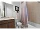 Clean bathroom with a shower/tub combo and granite countertop at 2777 Southland St, St Cloud, FL 34772