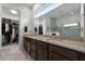 Bathroom with double vanity and walk-in shower at 2777 Southland St, St Cloud, FL 34772
