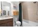 Clean bathroom with shower/tub combo, granite vanity, and updated fixtures at 2777 Southland St, St Cloud, FL 34772