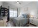 Cozy bedroom with a queen-size bed and built-in bookcases at 2777 Southland St, St Cloud, FL 34772