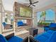 Relaxing community patio with fireplace, TV, and comfortable seating at 2777 Southland St, St Cloud, FL 34772