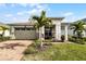 One-story home with a two-car garage and landscaped yard at 2777 Southland St, St Cloud, FL 34772