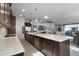 Open kitchen with large island and views into the living room at 2777 Southland St, St Cloud, FL 34772