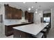 Spacious kitchen with dark wood cabinets and white countertops at 2777 Southland St, St Cloud, FL 34772