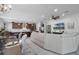 Open concept living space with modern decor and large TV at 2777 Southland St, St Cloud, FL 34772