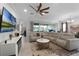 Spacious living area featuring a sectional sofa and large TV at 2777 Southland St, St Cloud, FL 34772