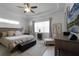 Spacious main bedroom with large windows and ceiling fan at 2777 Southland St, St Cloud, FL 34772