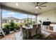 Relaxing screened patio with outdoor kitchen and dining furniture at 2777 Southland St, St Cloud, FL 34772