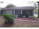 Back patio with space to relax, blending indoor comfort with outdoor charm at 32512 Oak Park Dr, Leesburg, FL 34748