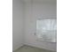 Bedroom with neutral walls, carpet, window and window blinds at 32512 Oak Park Dr, Leesburg, FL 34748