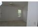 Bedroom with neutral carpet, one window, and a ceiling fan at 32512 Oak Park Dr, Leesburg, FL 34748