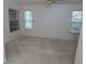 This is an empty bedroom featuring windows, carpet flooring, ceiling fan, and natural light at 32512 Oak Park Dr, Leesburg, FL 34748
