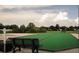 Enjoy outdoor recreation on this bocce ball court with seating and lush landscaping at 32512 Oak Park Dr, Leesburg, FL 34748
