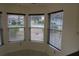 Sunny breakfast nook showcasing large windows with views of the outdoors at 32512 Oak Park Dr, Leesburg, FL 34748
