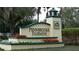 Pennbrooke Fairways community sign featuring red and white flowers and green landscaping at 32512 Oak Park Dr, Leesburg, FL 34748