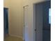 Hallway with neutral walls and tiled flooring at 32512 Oak Park Dr, Leesburg, FL 34748