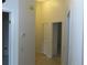 Hallway with neutral walls and tiled flooring at 32512 Oak Park Dr, Leesburg, FL 34748
