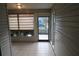 Bright sunroom featuring tile floors, offering a tranquil space with backyard views and natural light at 32512 Oak Park Dr, Leesburg, FL 34748