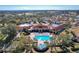 Community clubhouse with pool and surrounding landscape at 3713 Doune Way, Clermont, FL 34711