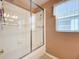 Simple bathroom featuring a shower/tub and white tile at 3713 Doune Way, Clermont, FL 34711